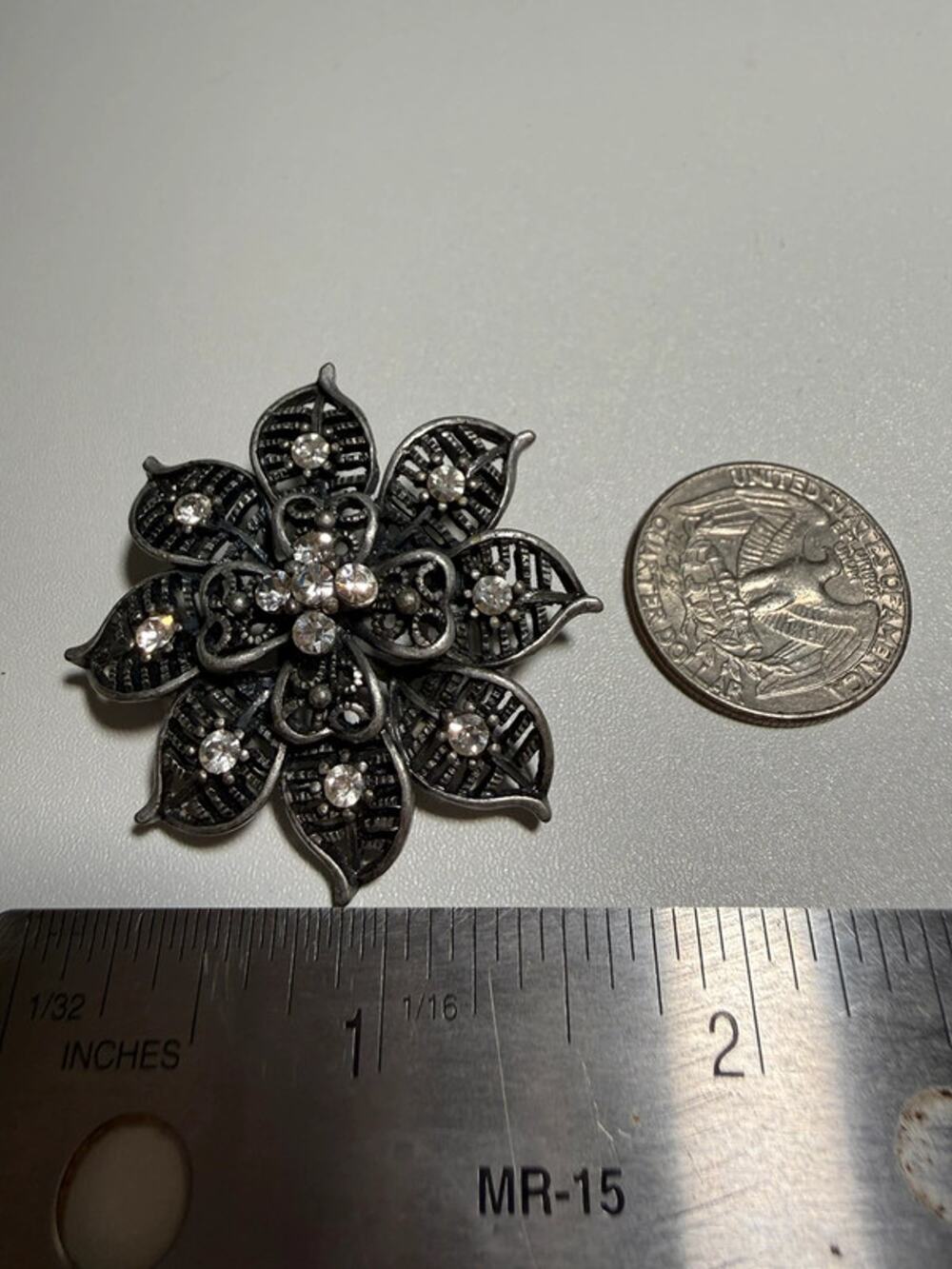 Silver tone floral rhinestone brooch 1.5”